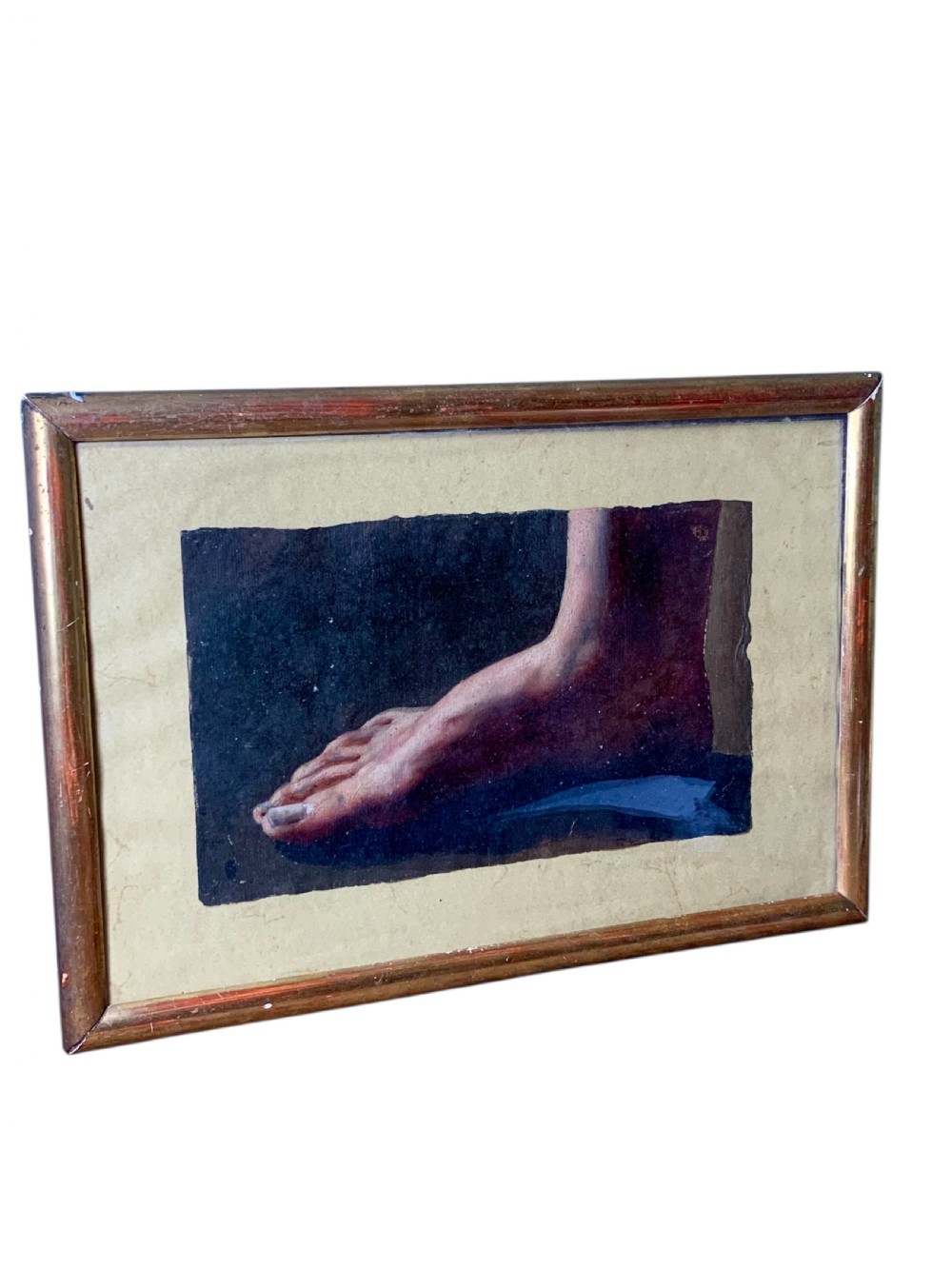 An early 19th-century academic oil study depicting a human foot rendered on paper, presented within a slender gilded wooden frame. View II