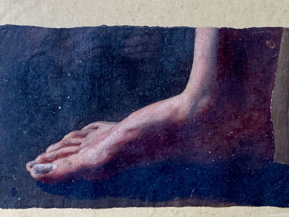 An early 19th-century academic oil study depicting a human foot rendered on paper, presented within a slender gilded wooden frame. View VII