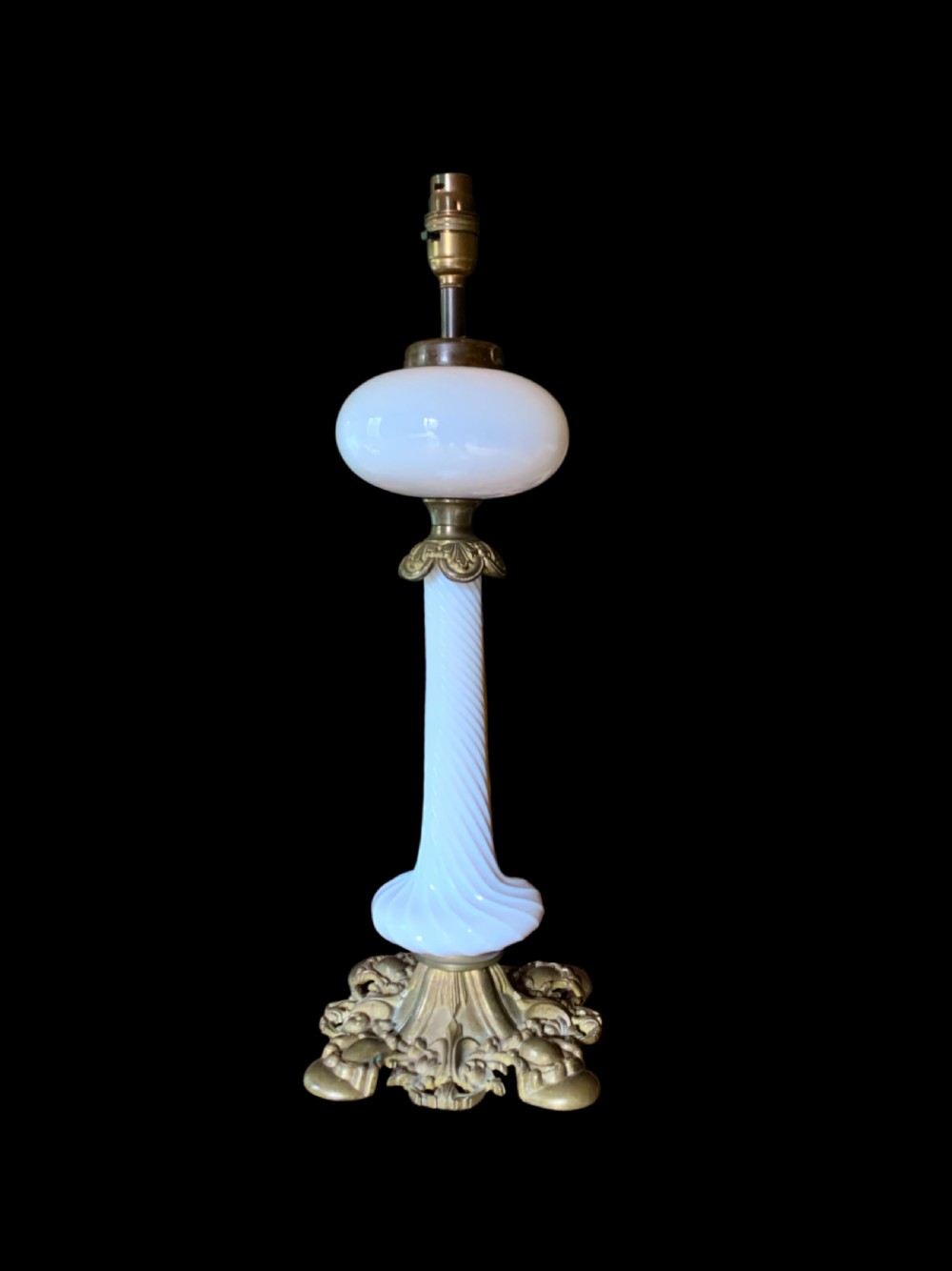 A 19th-century Victorian table lamp featuring a white fluted opaline glass column set on an ornate cast bronze base. View III