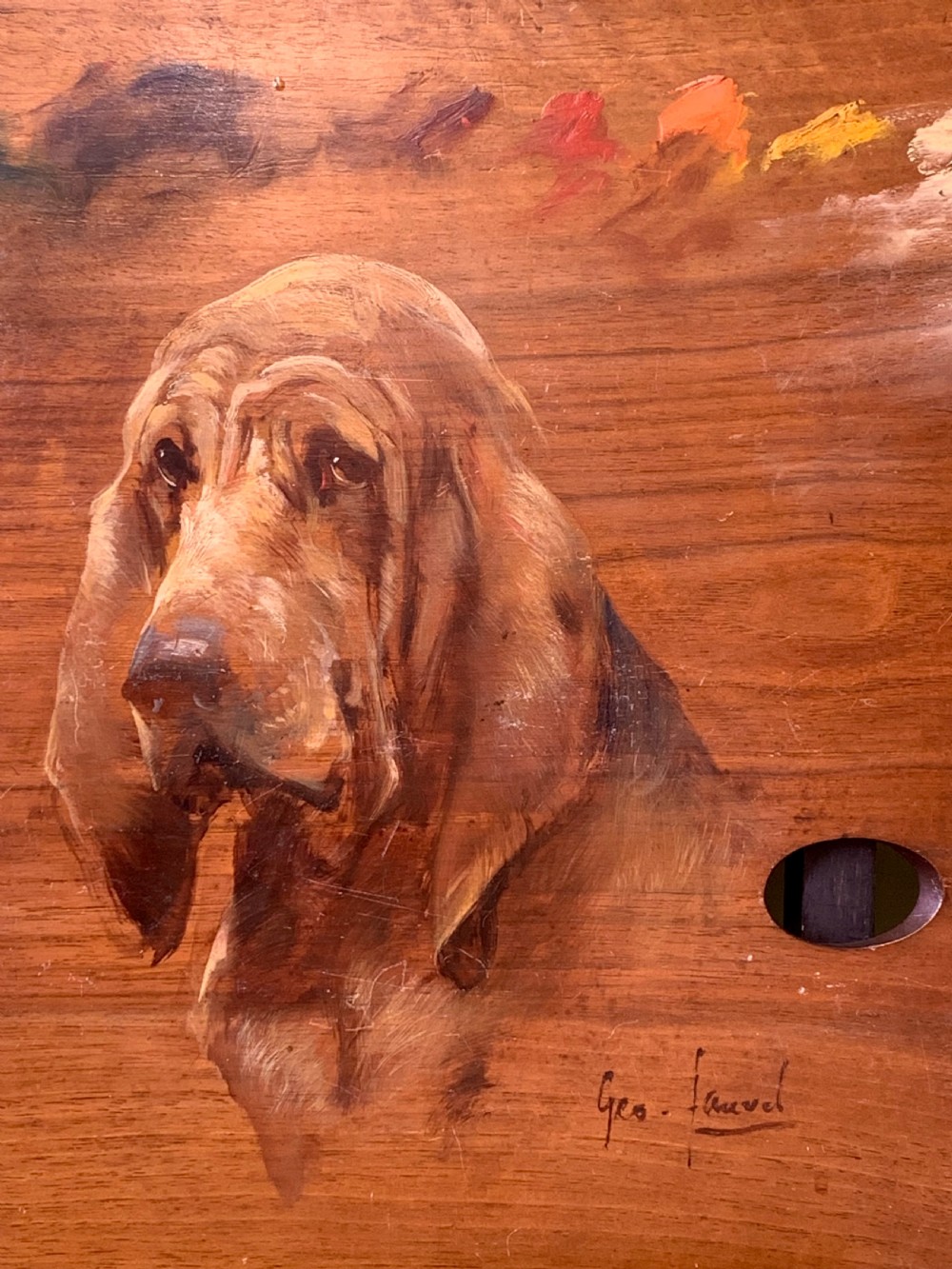 A nineteenth-century oil painting depicting the head of a bloodhound executed directly onto a wooden artists palette with paint swatches visible along the upper edge. View III