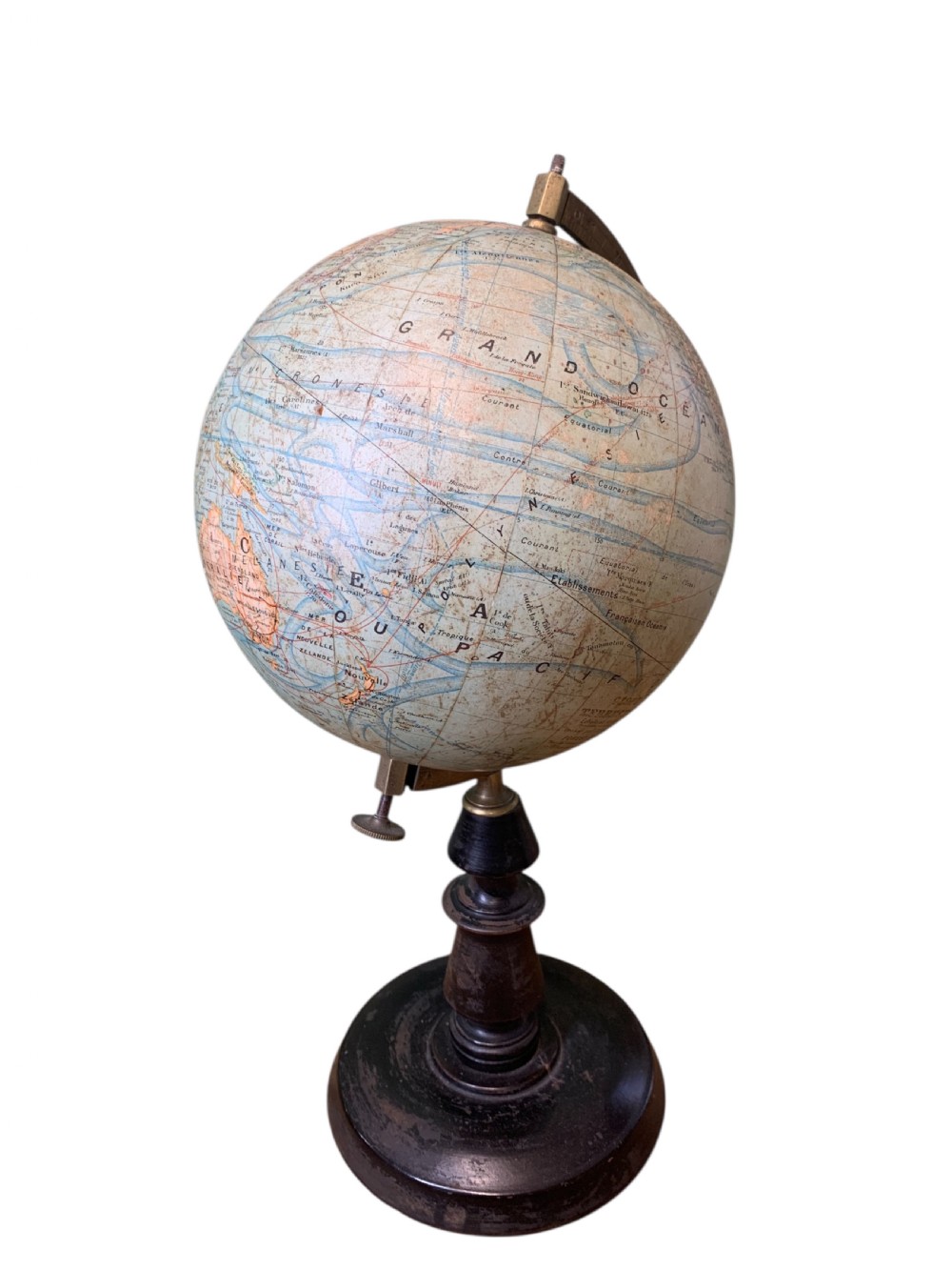 A vintage French terrestrial globe featuring cream paper map gores on a brass meridian half-ring and a turned dark wood pedestal base. View III