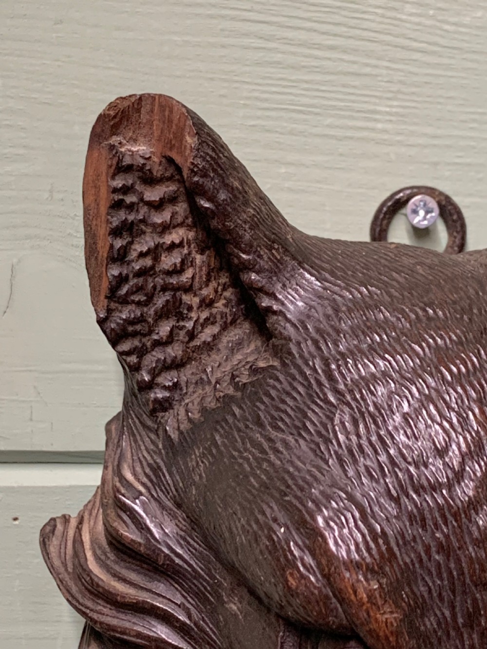 Pair of detailed hand-carved dark wood wall sculptures depicting a fox head and a hound head. View IX