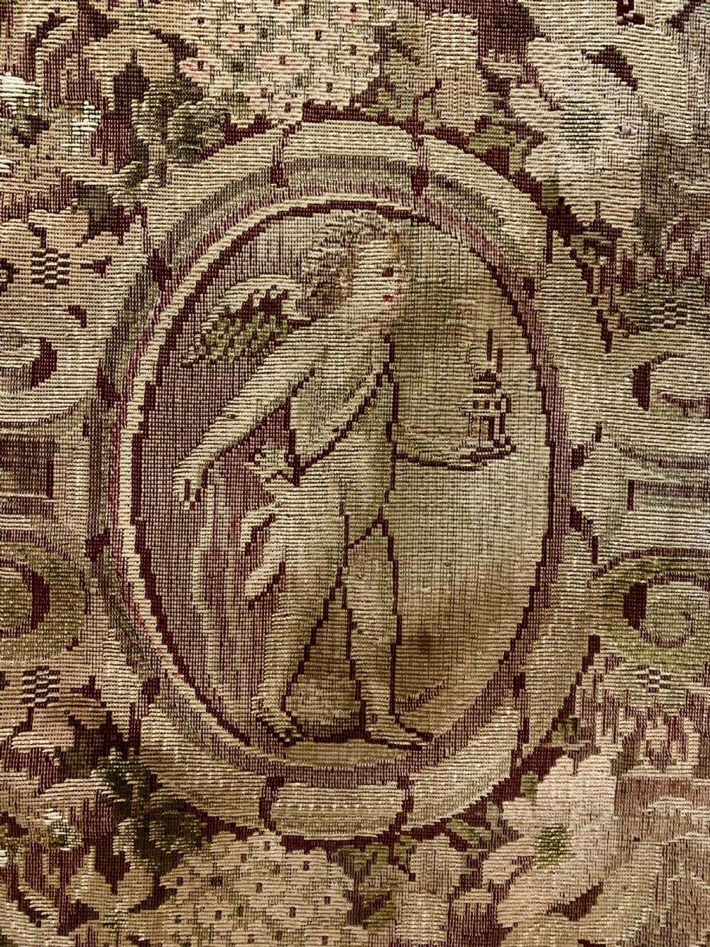 Three vertical woven French tapestry panels displaying floral garlands, urns, and foliate scrollwork in neutral beige, rose, and green tones. View VIII