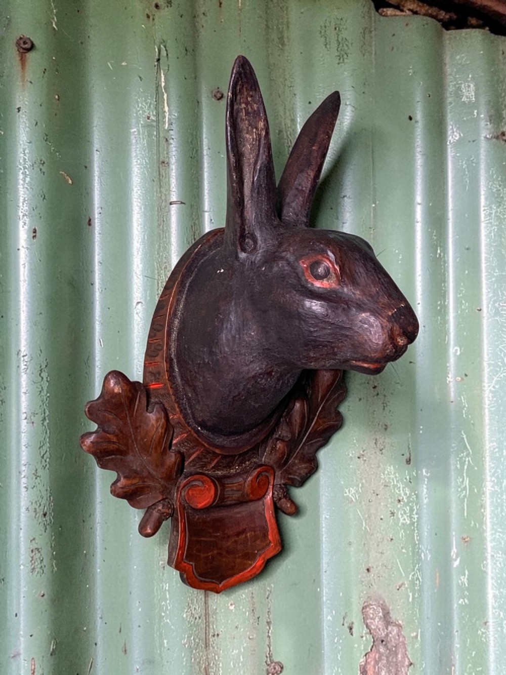 A CHARMING NAIVE FOLK ART CARVED HARE HEAD