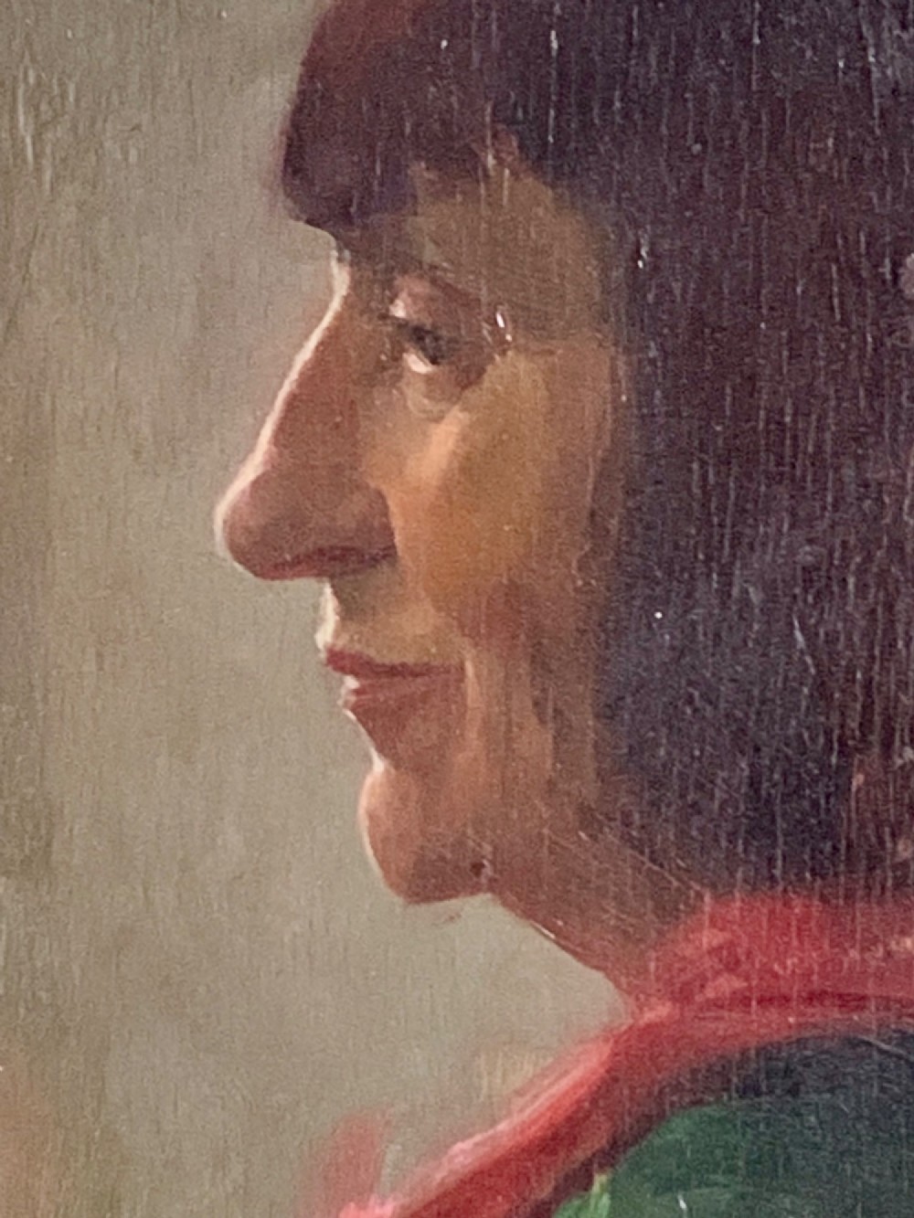 A side profile oil portrait painting of a woman with dark bobbed hair wearing a red scarf against a muted grey background. View IV