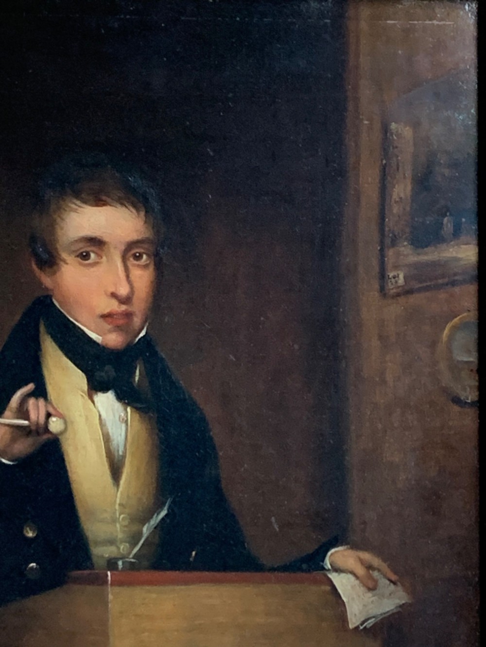 An early 19th-century oil portrait depicting a gentleman at a podium holding a small mallet, housed within a gold leaf frame. View VI