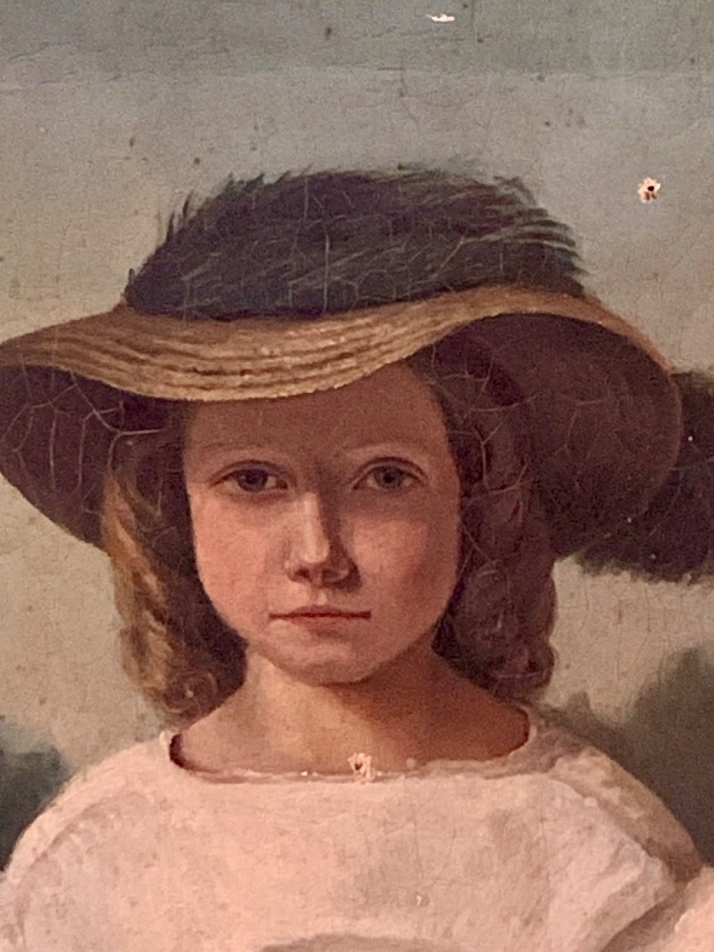 An early 19th-century oil portrait depicting a young girl in a white puff-sleeved dress and bonnet holding a book. View VI