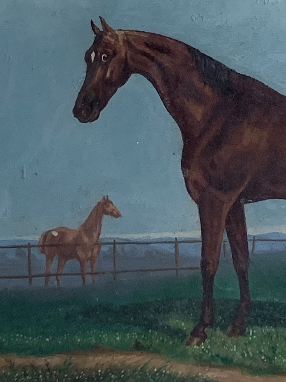An antique oil painting on wood panel depicting a brown horse standing in a grassy landscape under a blue sky, set within a black ebonised frame with a gilt inner border. View III