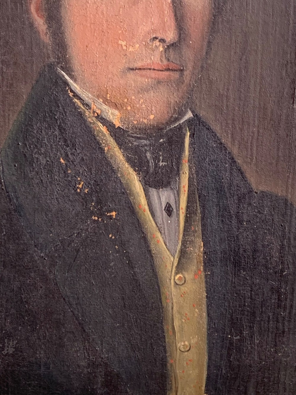 A 19th-century oil portrait on canvas depicting a gentleman with blue eyes, dark hair, a yellow waistcoat, and a dark blue coat. View V