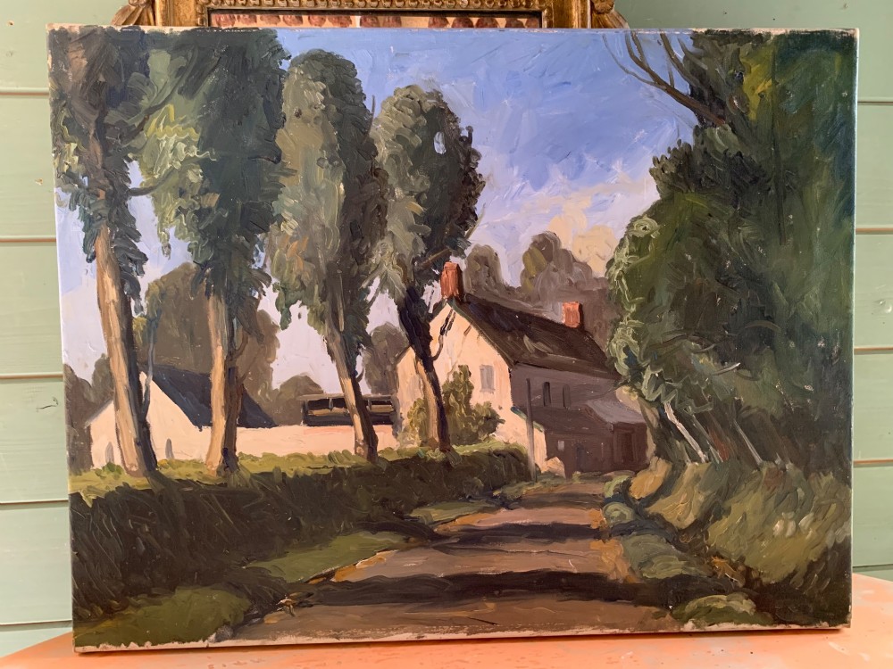 An early twentieth-century French oil painting depicting a sunlit country lane leading past tall trees towards a white farmhouse with terracotta chimneys under a light blue sky. View III