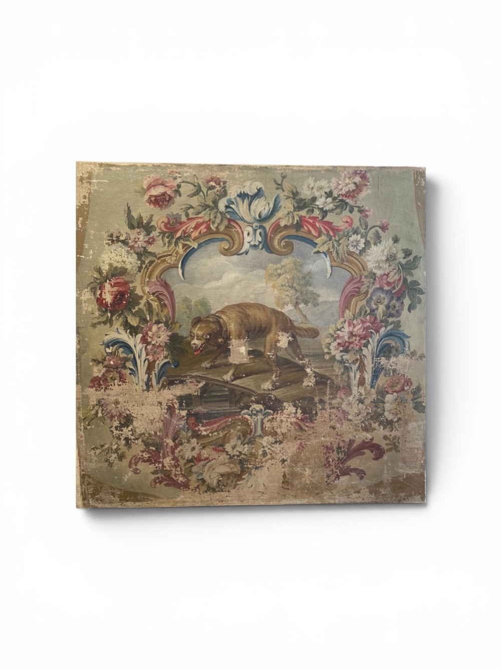 An early 19th-century oil painting on canvas featuring a brown dog framed by a floral cartouche against a muted sage green background. View II