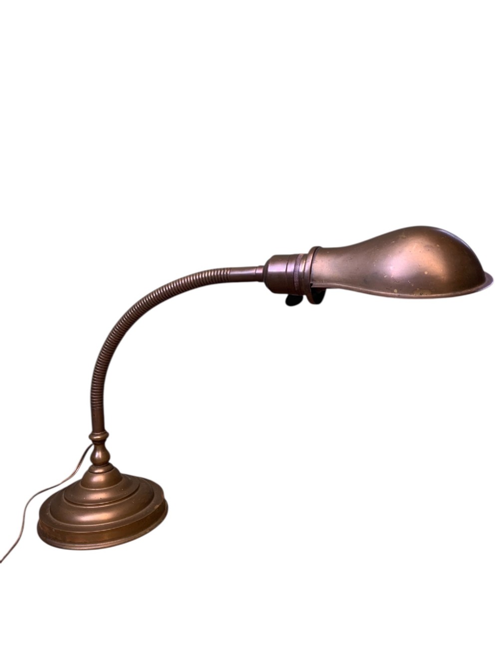 An antique French desk lamp crafted from patinated brass, featuring a weighted circular base, a flexible gooseneck stem, and an adjustable brass shade. View V