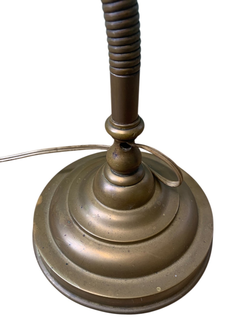 An antique French desk lamp crafted from patinated brass, featuring a weighted circular base, a flexible gooseneck stem, and an adjustable brass shade. View VIII