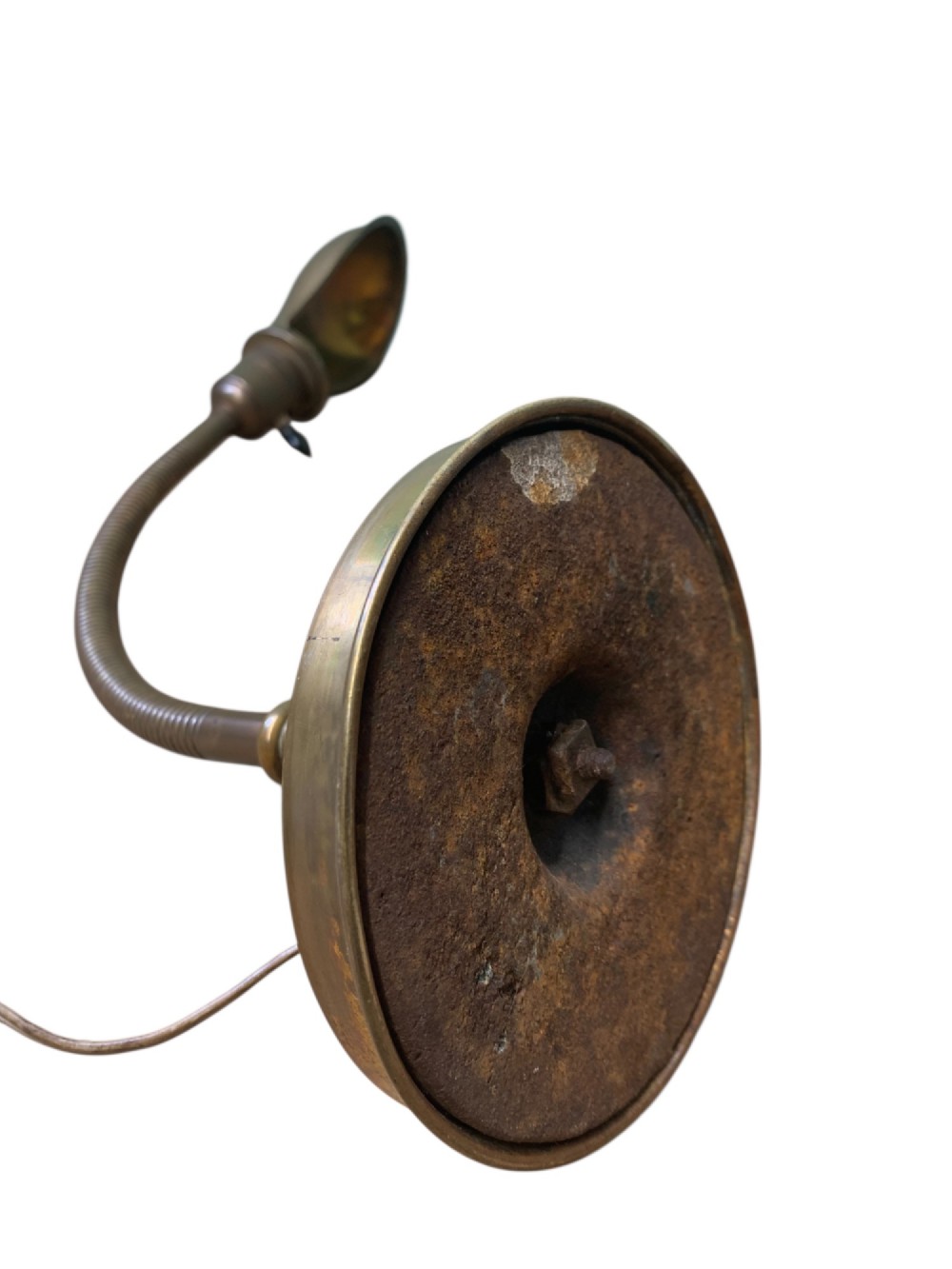 An antique French desk lamp crafted from patinated brass, featuring a weighted circular base, a flexible gooseneck stem, and an adjustable brass shade. View X