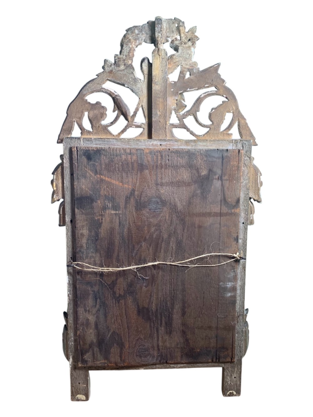 An 18th-century French giltwood marriage mirror with an ornate carved crest featuring doves, floral garlands, and a rectangular beaded mirror frame. View X