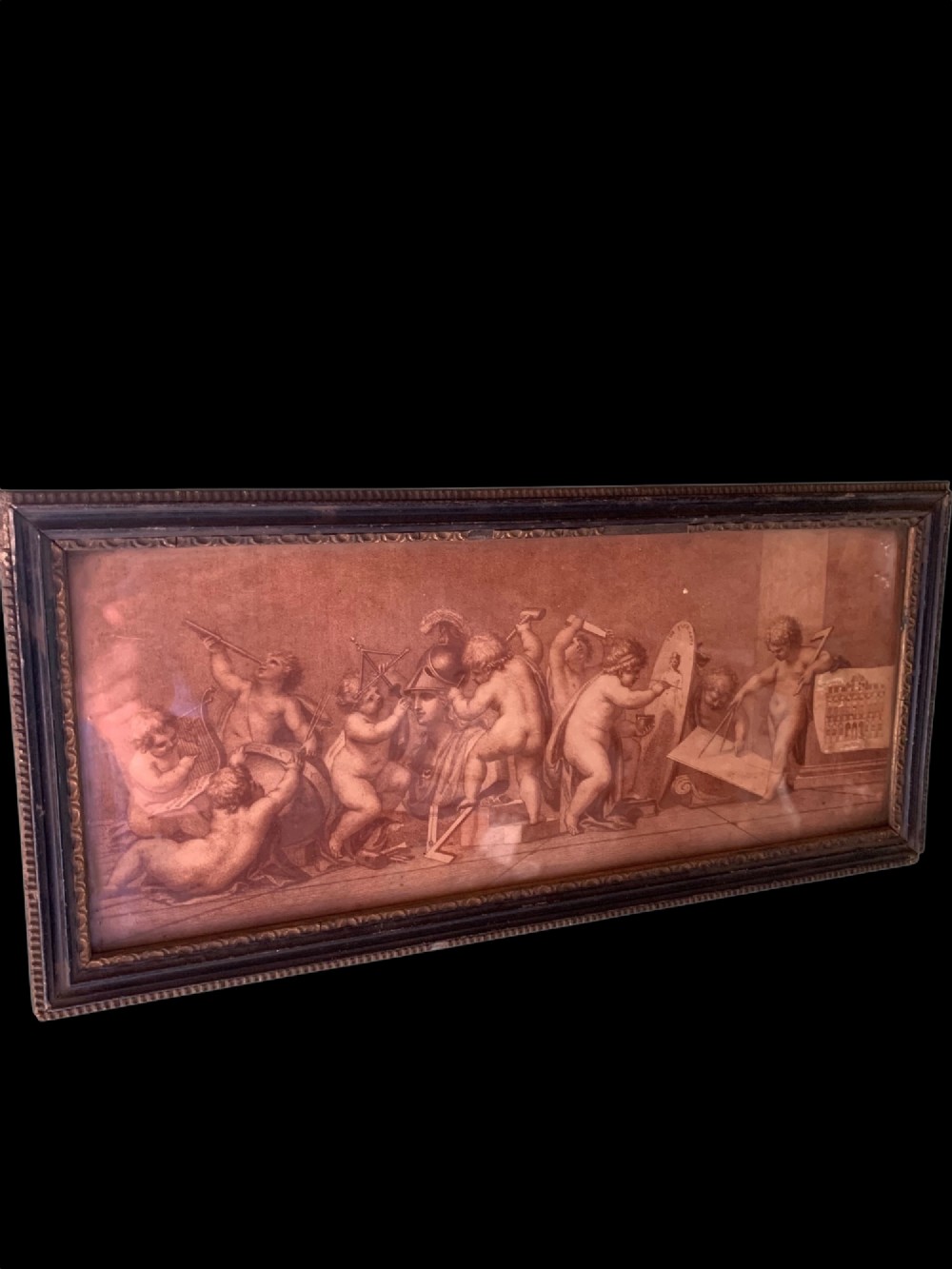 A horizontal monochrome 18th-century style framed engraving depicting classical putti engaged in artistic and architectural pursuits. View II