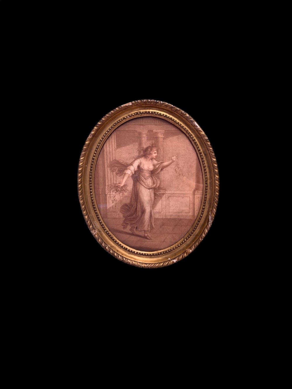 An 18th-century oval stipple engraving depicting a draped classical figure with foliage, housed in a beaded giltwood frame. View II