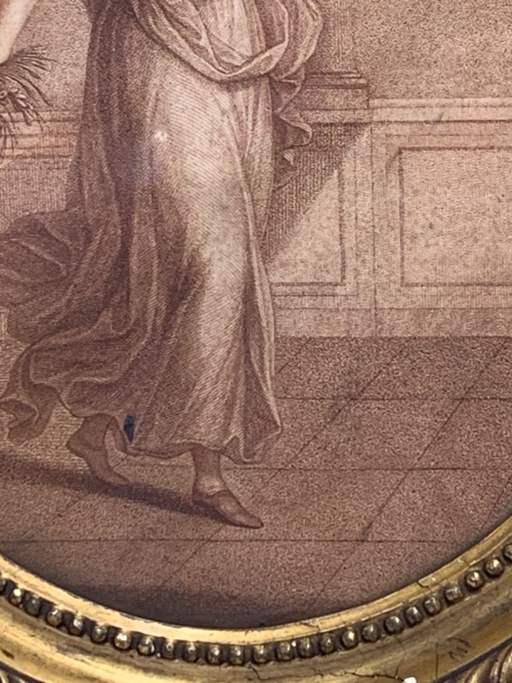 An 18th-century oval stipple engraving depicting a draped classical figure with foliage, housed in a beaded giltwood frame. View VII