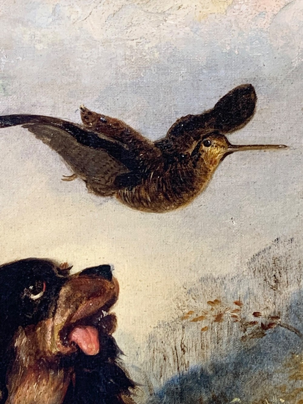A 19th-century oil painting depicting a black and tan spaniel seated in a landscape looking upward at a woodcock bird in flight. View VI