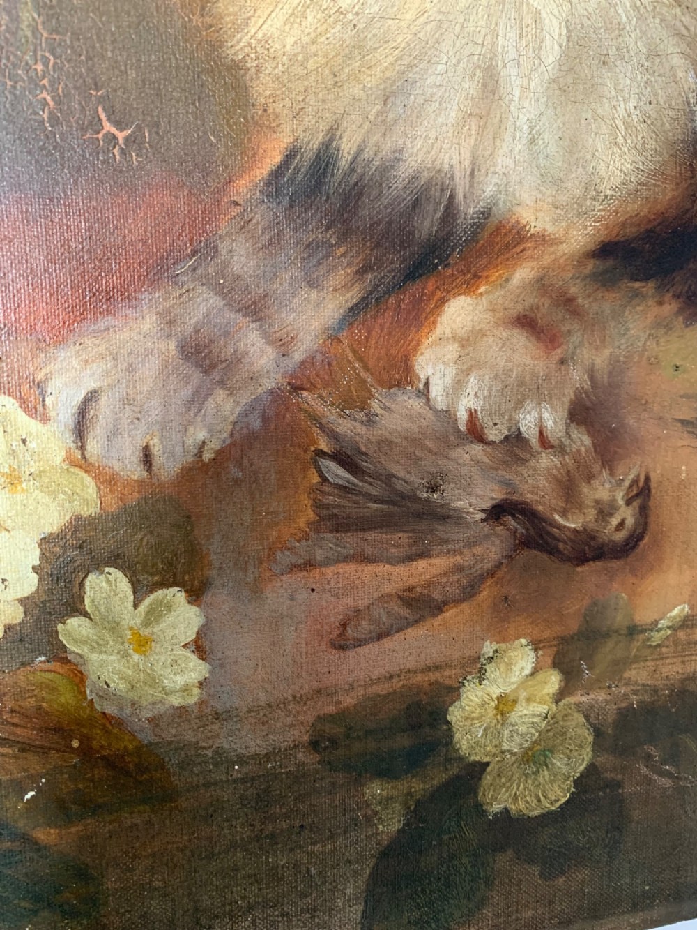 A 19th-century naive school oil painting depicting a fluffy longhaired cat holding a small bird, set beside pale cream flowers against a warm brown background. View IV