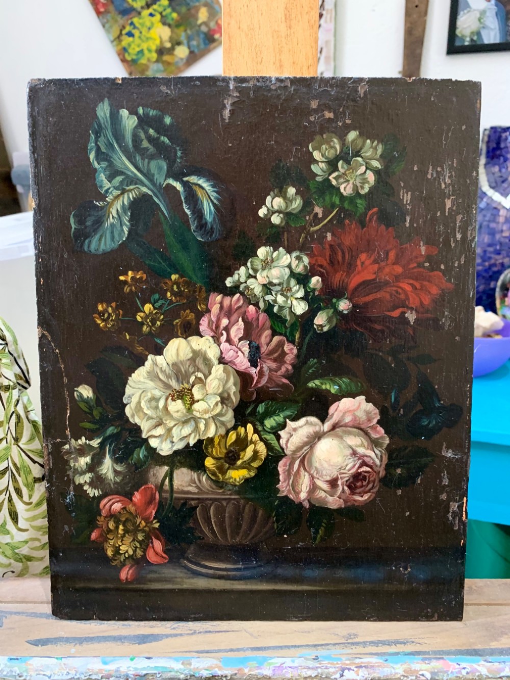 A framed Dutch School style oil painting on wood panel featuring a varied arrangement of flowers in a fluted urn set against a dark background. View IV