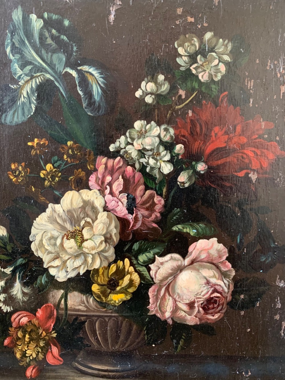A framed Dutch School style oil painting on wood panel featuring a varied arrangement of flowers in a fluted urn set against a dark background. View V