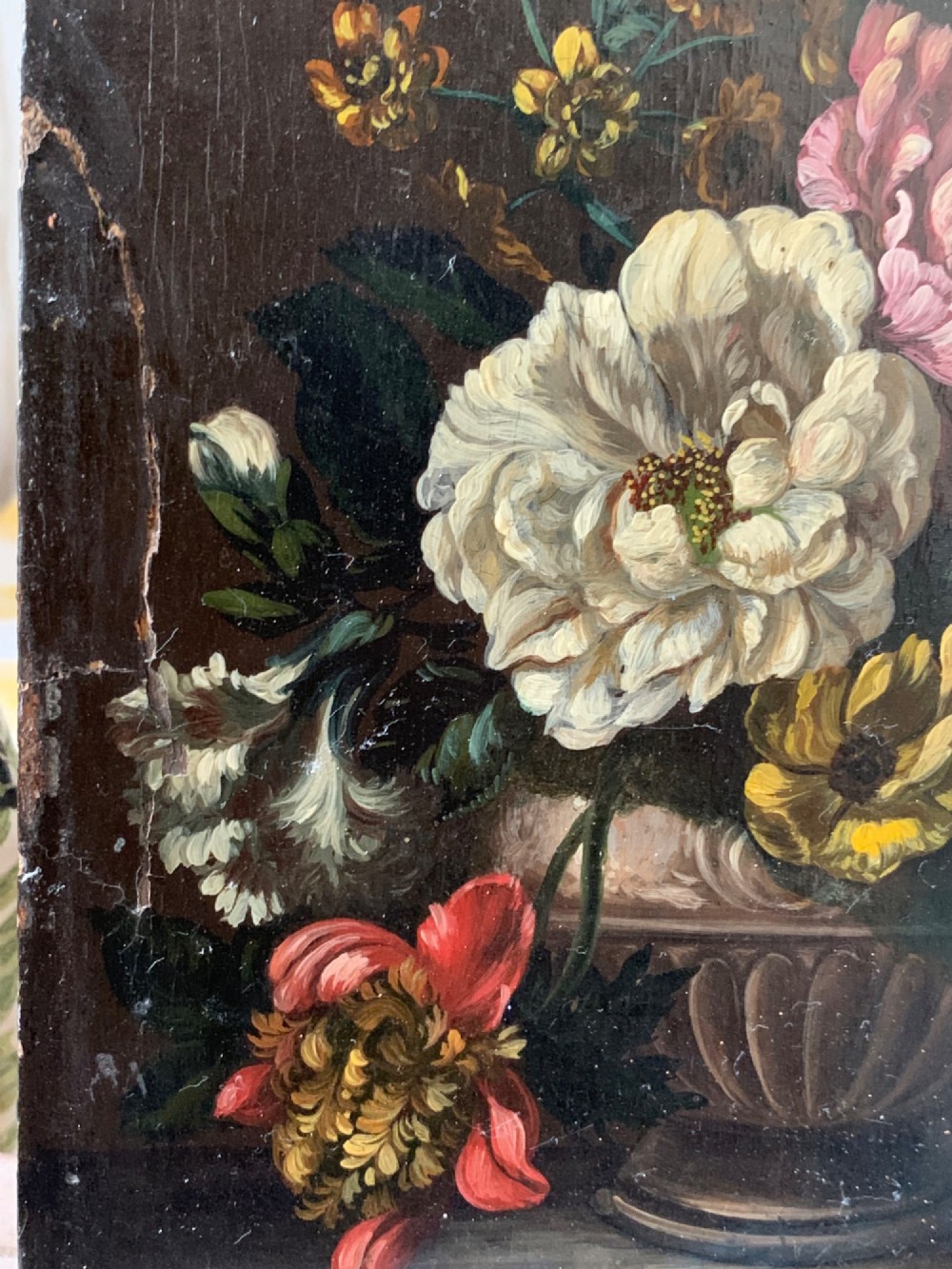 A framed Dutch School style oil painting on wood panel featuring a varied arrangement of flowers in a fluted urn set against a dark background. View VII