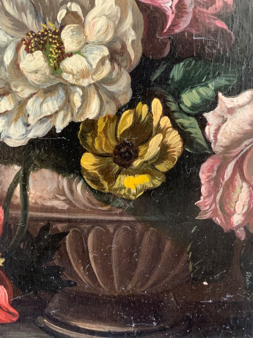 A framed Dutch School style oil painting on wood panel featuring a varied arrangement of flowers in a fluted urn set against a dark background. View IX