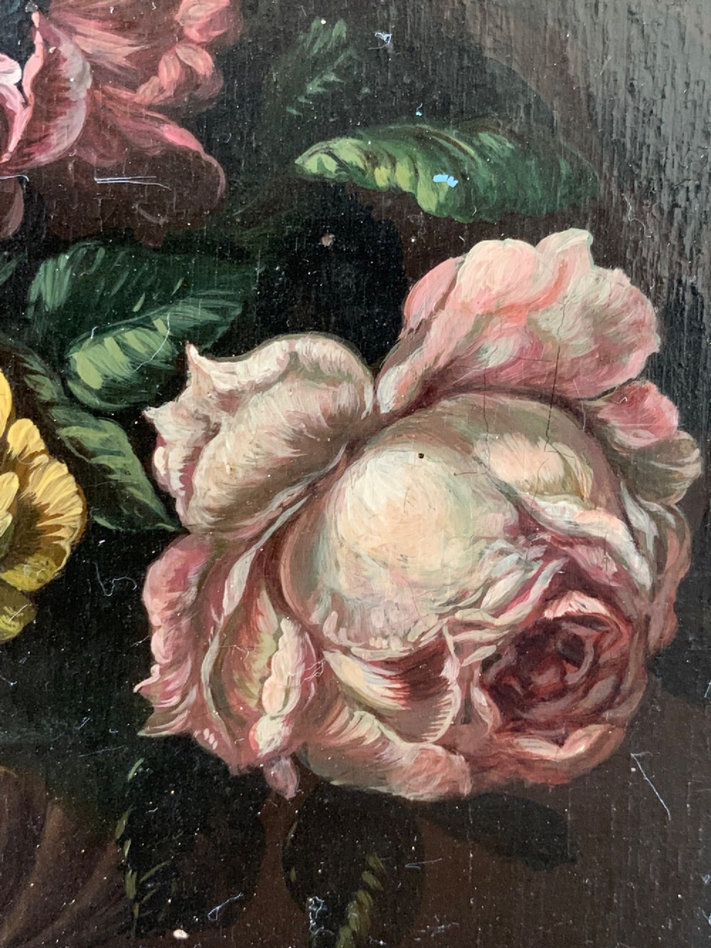 A framed Dutch School style oil painting on wood panel featuring a varied arrangement of flowers in a fluted urn set against a dark background. View X