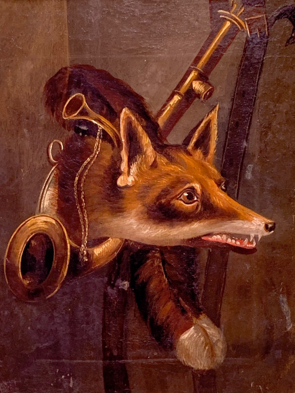 A 19th-century oil painting on canvas depicting a fox head trophy alongside a brass hunting horn and whip against a dark brown background. View II