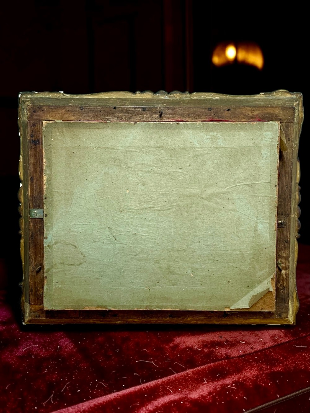 An antique gilt-framed shadow box diorama depicting four miniature costumed theatrical figures against a crimson draped fabric backdrop. View XIII