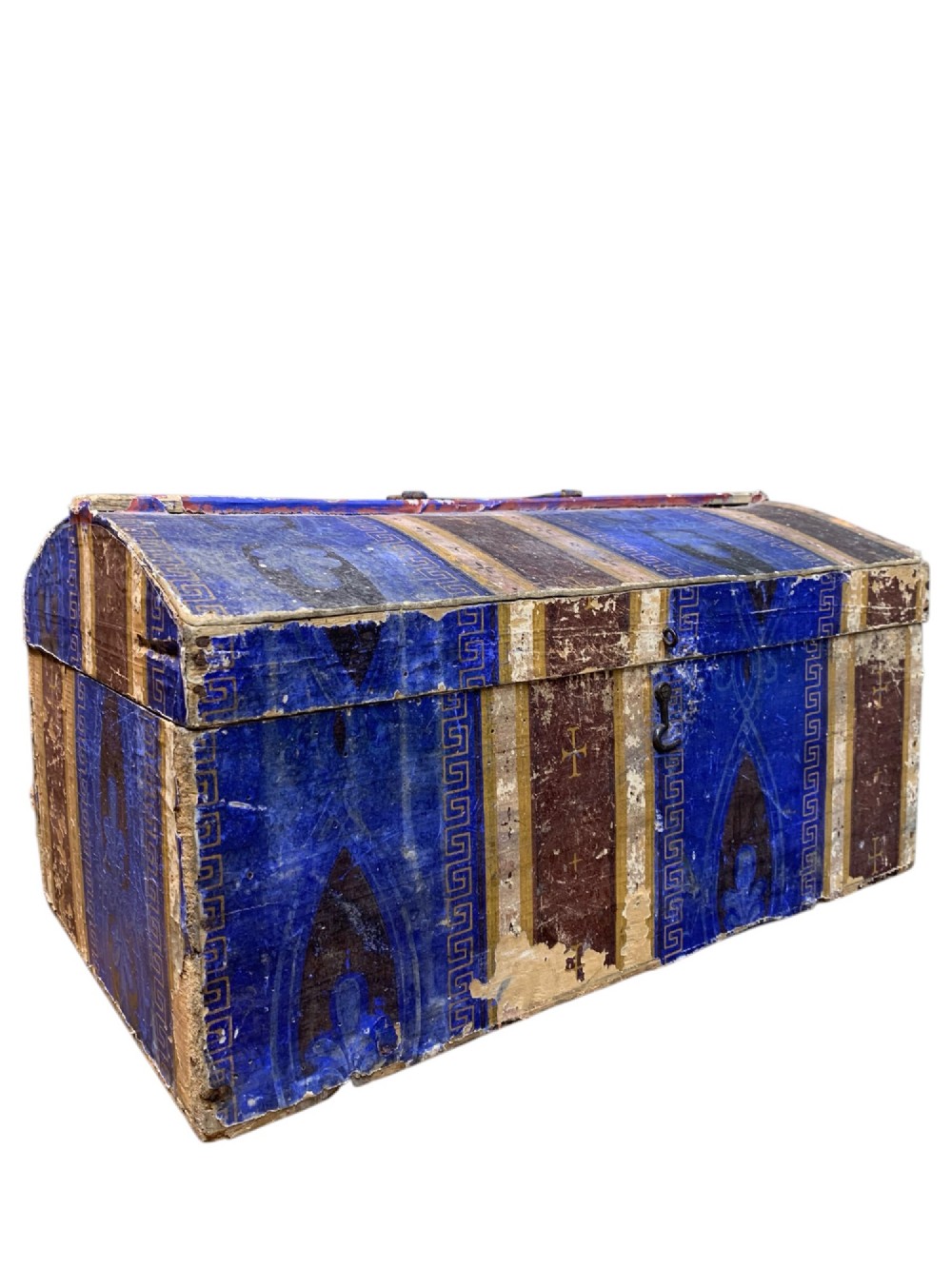An 18th-century domed-top wooden dowry box covered in patterned blue and brown block-printed paper with iron hardware.