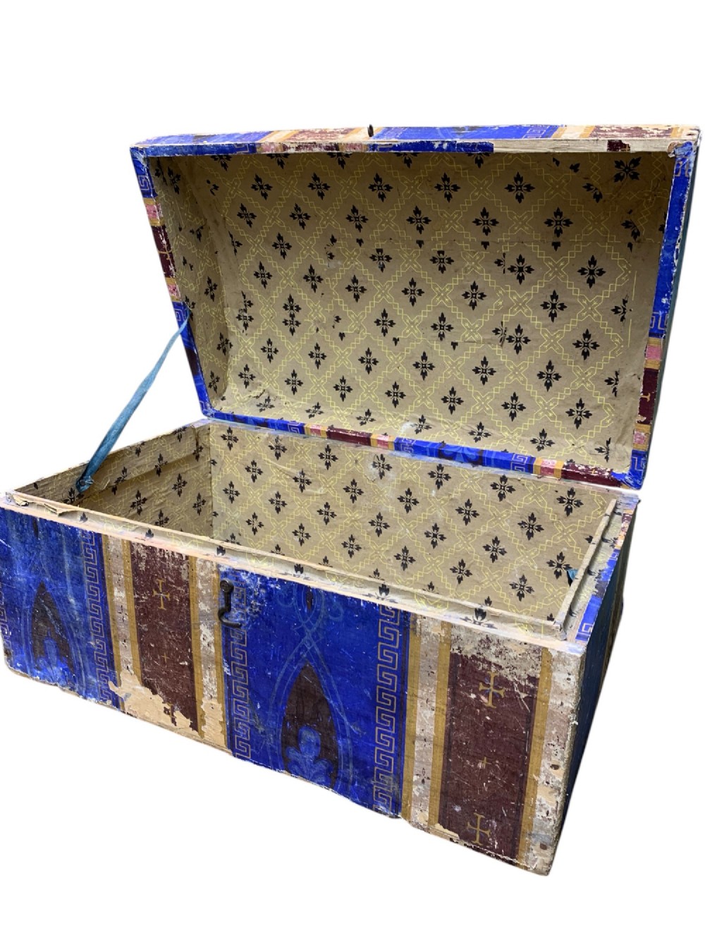 An 18th-century domed-top wooden dowry box covered in patterned blue and brown block-printed paper with iron hardware. View VII