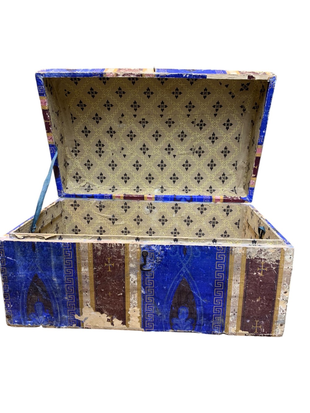 An 18th-century domed-top wooden dowry box covered in patterned blue and brown block-printed paper with iron hardware. View VIII