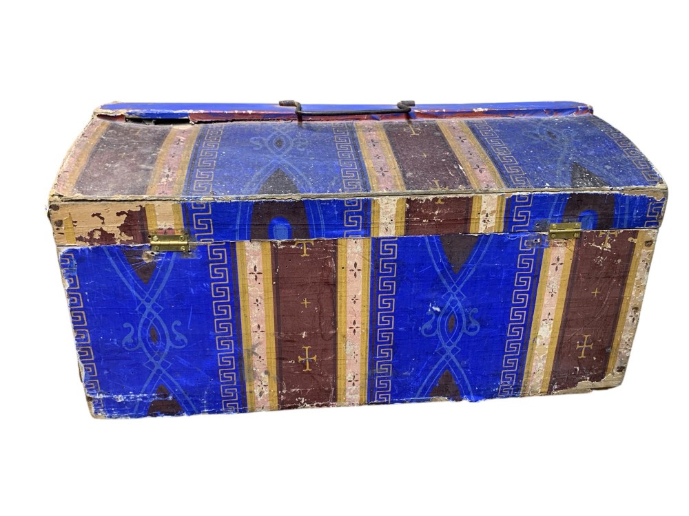An 18th-century domed-top wooden dowry box covered in patterned blue and brown block-printed paper with iron hardware. View IX