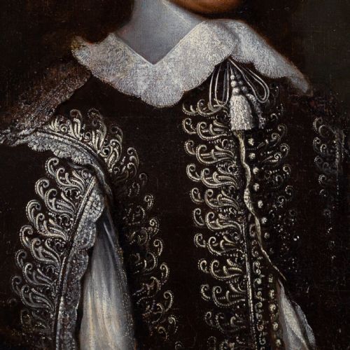 fig 2. An antique oil painting depicting a 17th-century gentleman with a lace collar set within a dark background and framed by an ornate gilt and ebonised border.