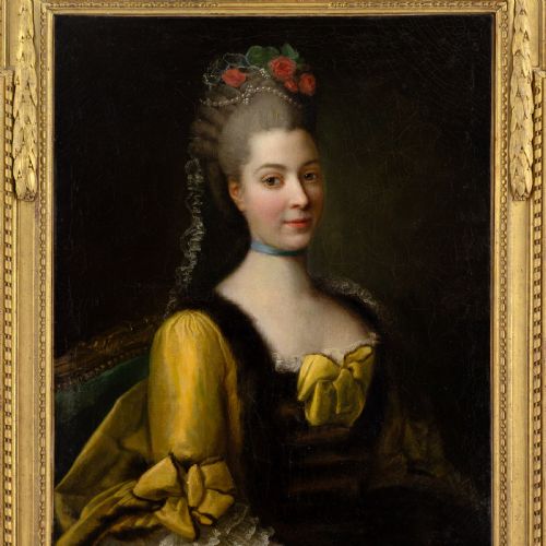 fig 4. An eighteenth-century French oil painting on canvas depicting a lady with powdered hair and a yellow dress, housed in a carved gold leaf frame.