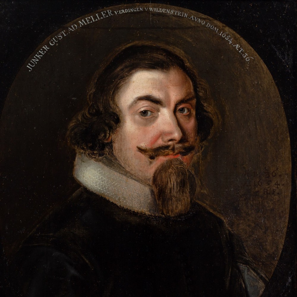 A 17th-century oil portrait depicting a gentleman with a pointed beard and white collar set within a painted oval spandrel and dark wooden frame. View V