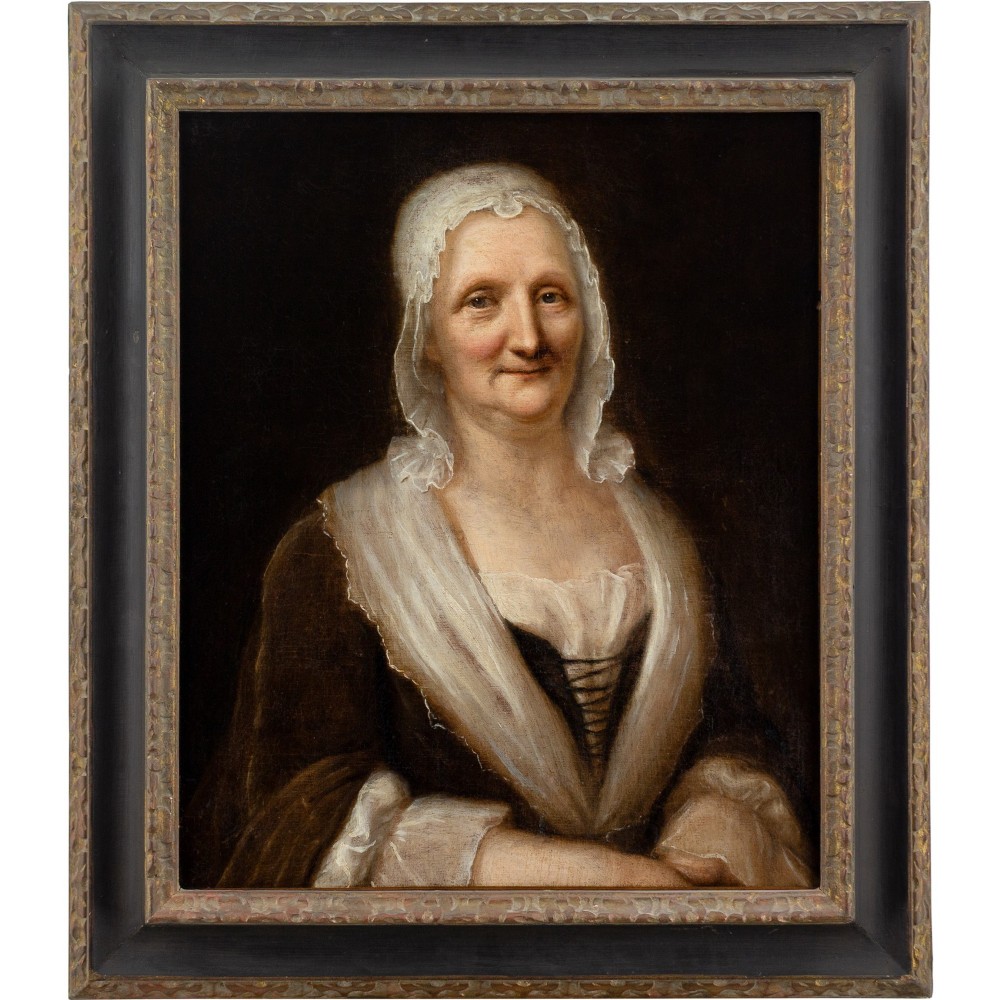 An eighteenth-century oil portrait of an elderly woman wearing a lace bonnet and dark gown, set within a black and gilt wooden frame.