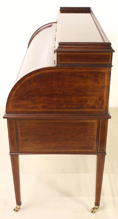 fig 4. Inlaid Mahogany Cylinder Bureau by Maple and Co