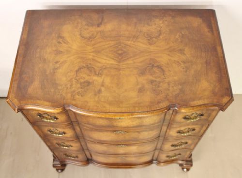 fig 2. Burr Walnut Serpentine fronted Chest by Waring and Gillow