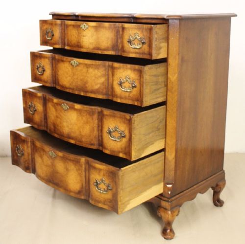 fig 4. Burr Walnut Serpentine fronted Chest by Waring and Gillow