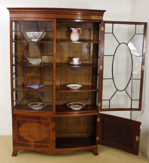 fig 4. Maple and Co Bow Fronted Display Cabinet
