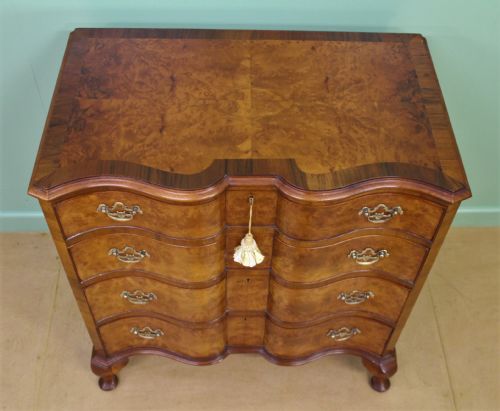 fig 1. Waring and Gillow Burr Walnut Serpentine Chest of Drawers