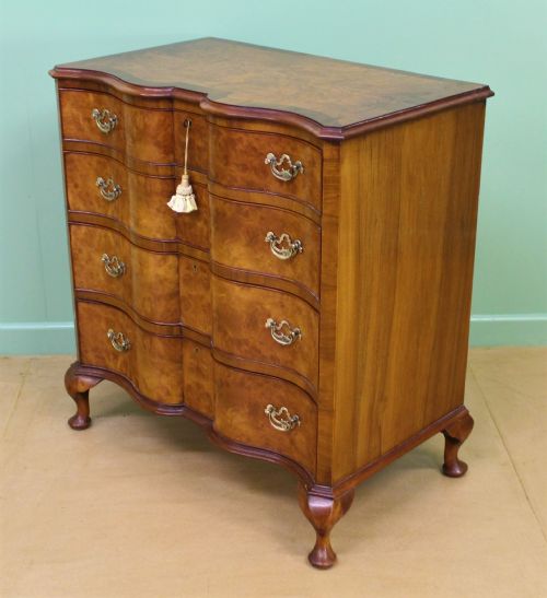 fig 2. Waring and Gillow Burr Walnut Serpentine Chest of Drawers