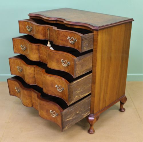 fig 3. Waring and Gillow Burr Walnut Serpentine Chest of Drawers
