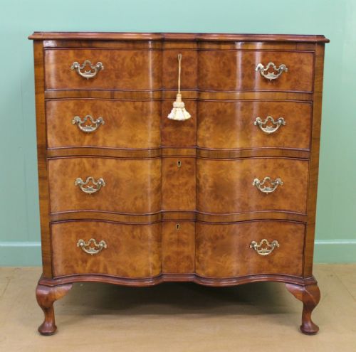 fig 5. Waring and Gillow Burr Walnut Serpentine Chest of Drawers