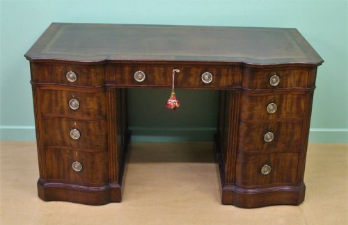 Serpentine Fronted Pedestal Desk by Waring and Gillow