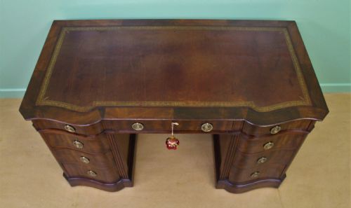 fig 1. Serpentine Fronted Pedestal Desk by Waring and Gillow