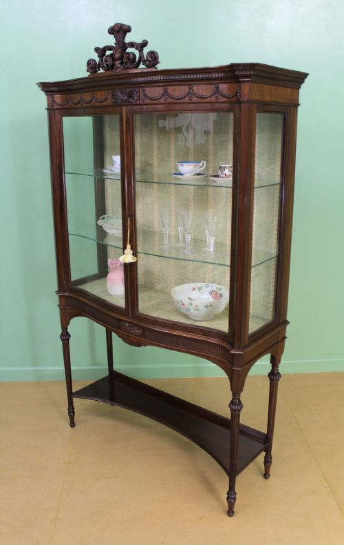 fig 3. Serpentine Mahogany Display Cabinet by Maple and Co